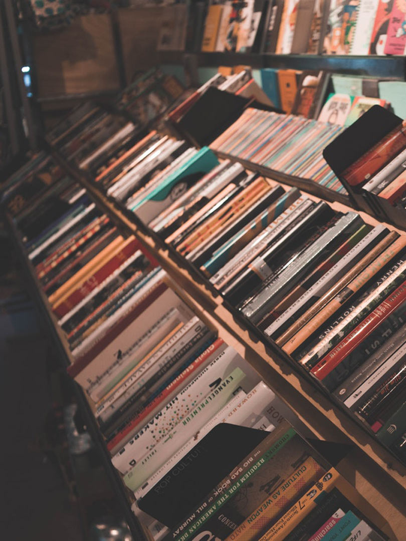 bookshelf showing books by category